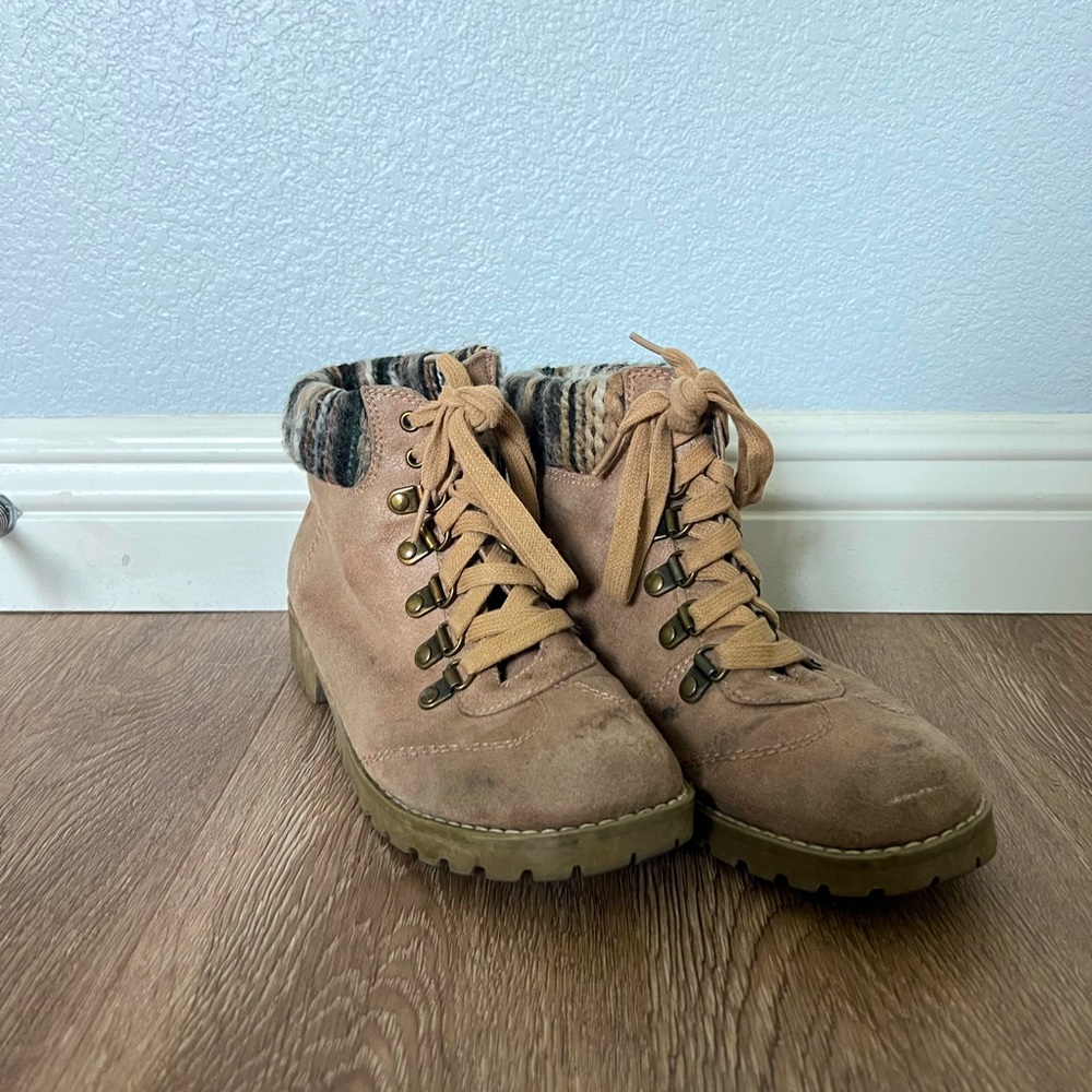 These boots are great for a fall/winter look. The material is suede.